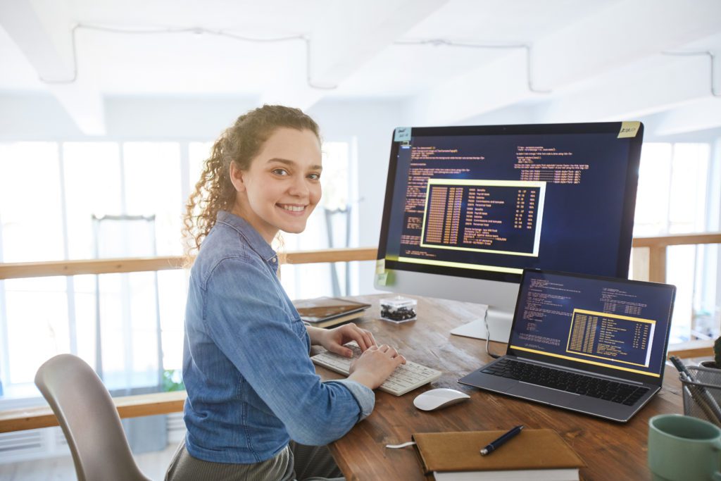 Female web developer and designer at work or digital work on computer